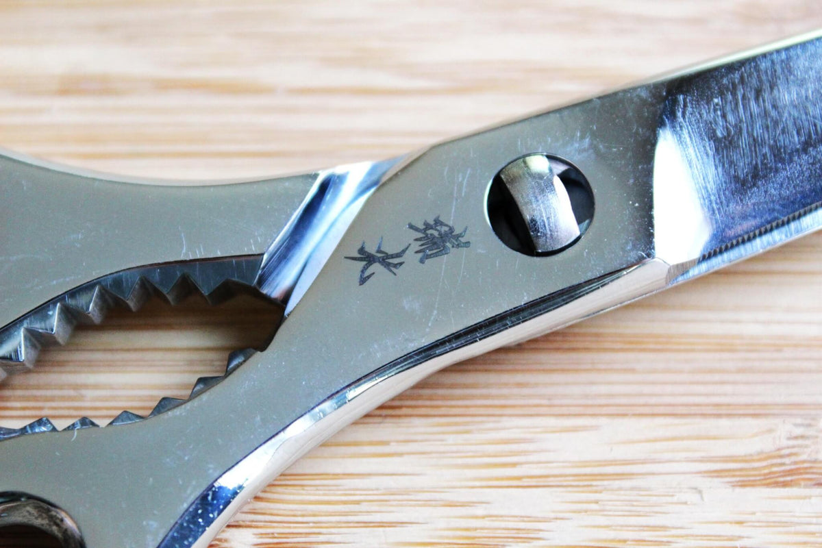Zuiko 190mm all-stainless steel Japanese kitchen shears closed, showing one-piece metal handles and Sakai cutlery