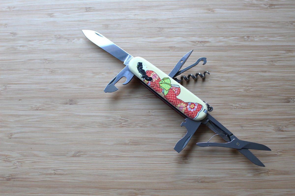 Victorinox Climber 91mm Swiss Army Knife fully opened with all 14 stainless steel tools displayed, including large blade, small blade, scissors, and corkscrew