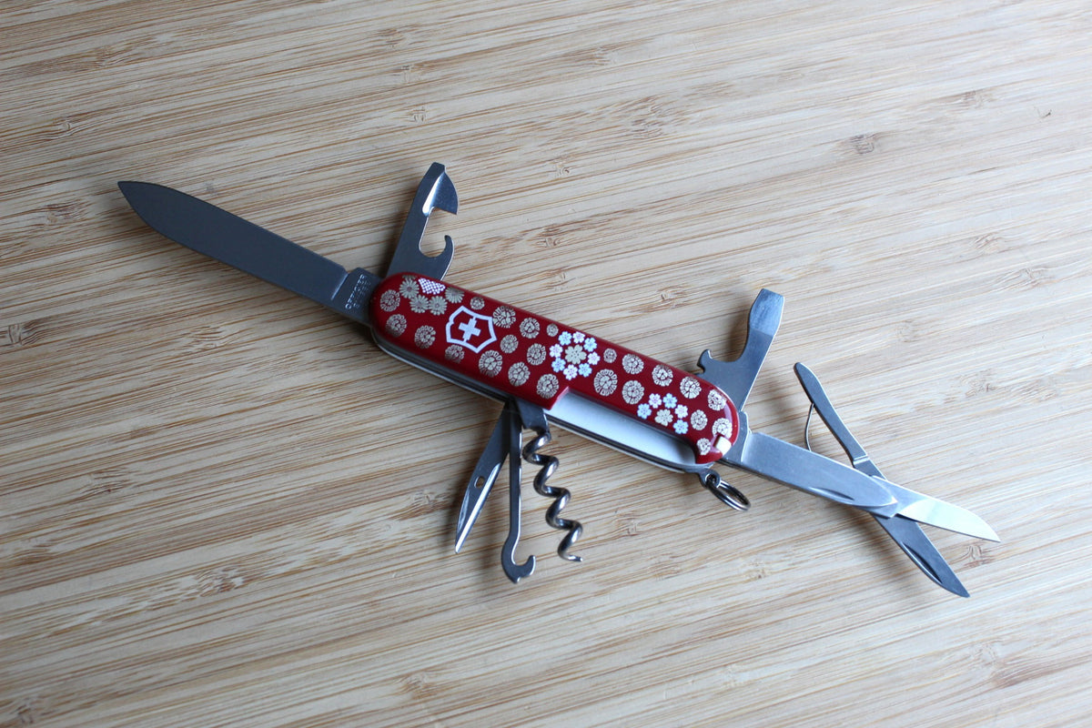 Victorinox Climber 91mm Swiss Army Knife fully opened with all 14 stainless steel tools displayed, including large blade, small blade, scissors, and corkscrew