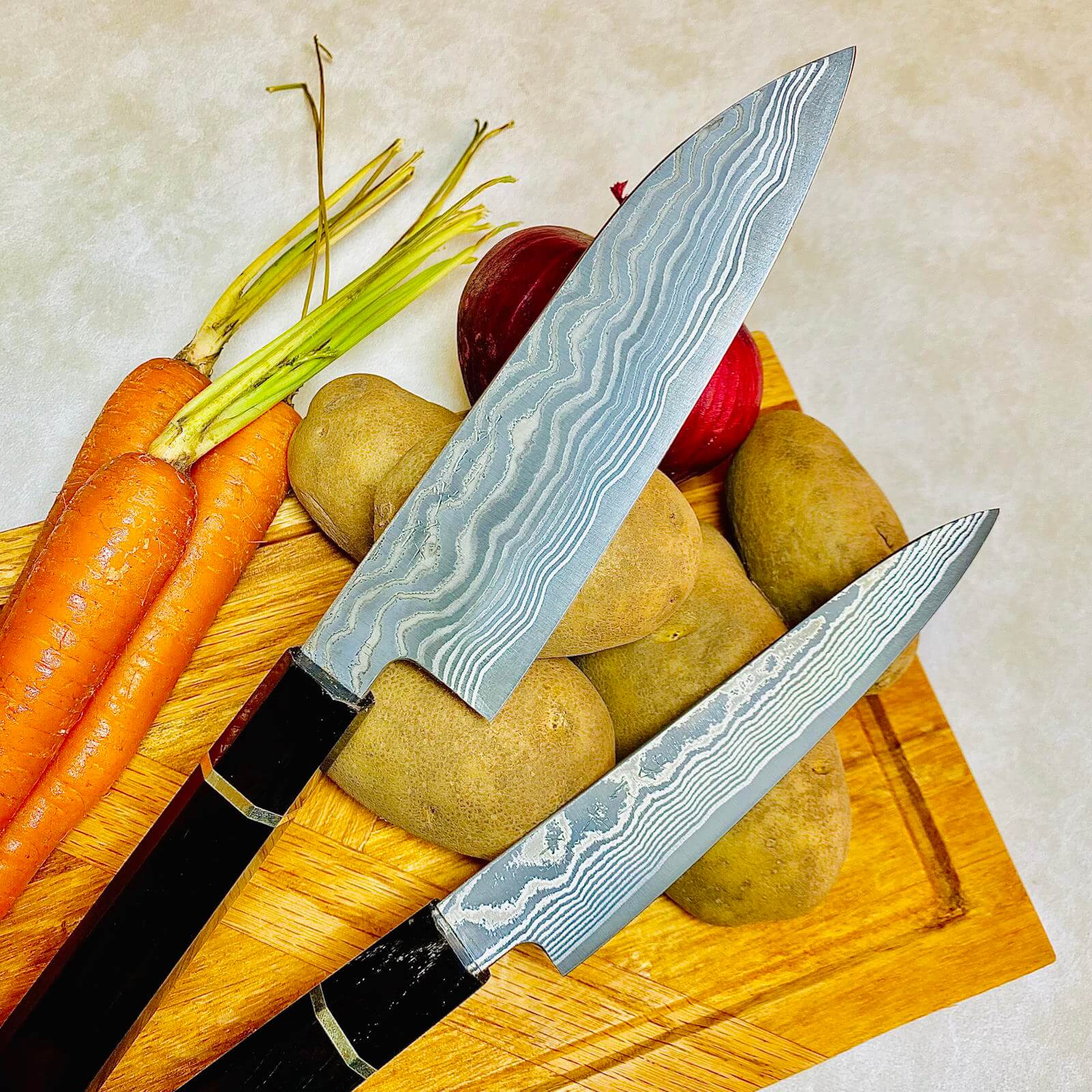 Fujiwara_Yasuhiko_Gyuto_and_Petty_SG2_on_cutting_board