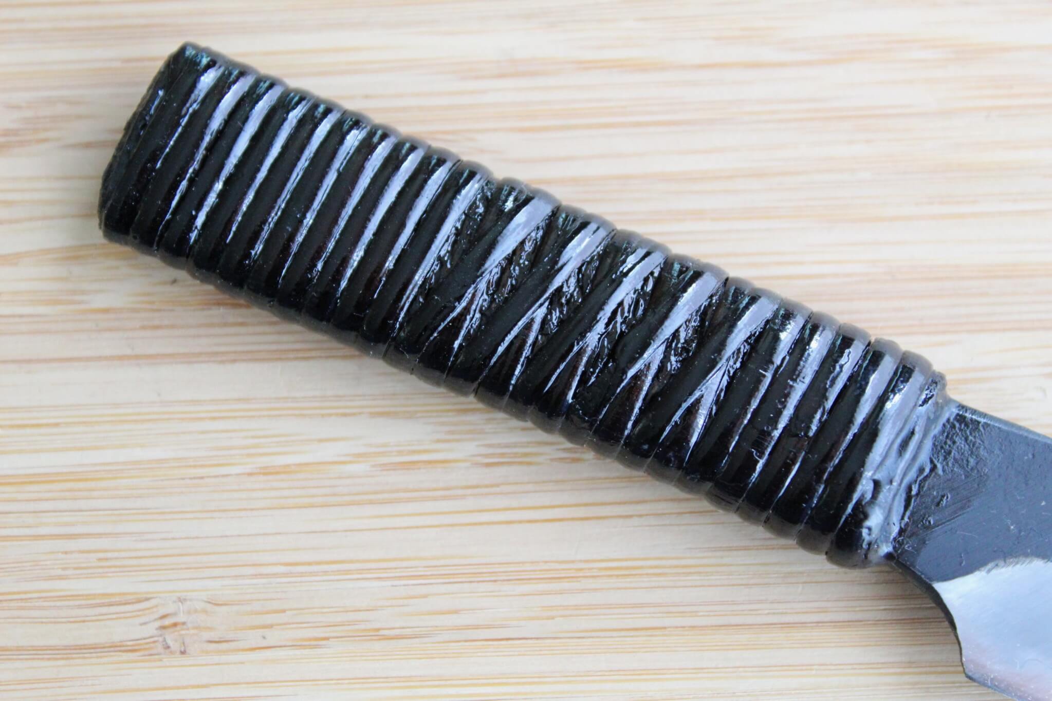 Detail of traditional Fujimaki rattan-wrapped full-tang handle on a Kyoto-forged knife