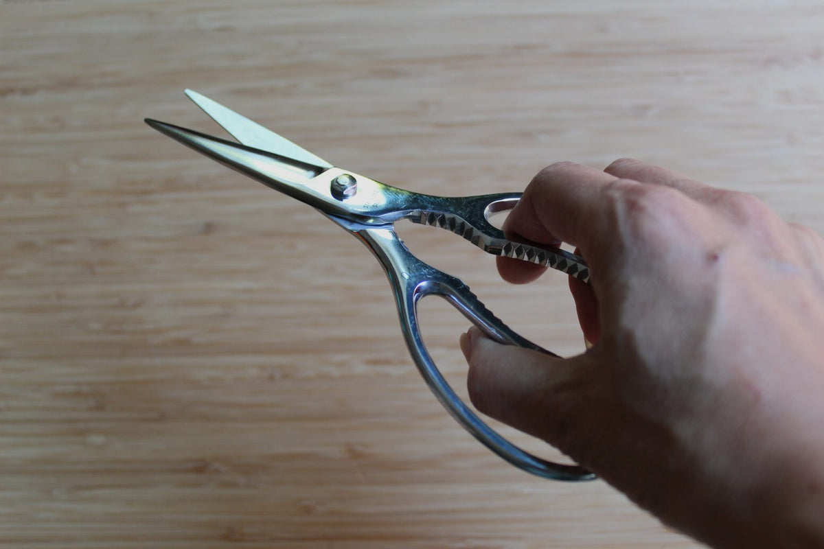 Zuiko 190mm all-stainless steel Japanese kitchen shears closed, showing one-piece metal handles and Sakai cutlery