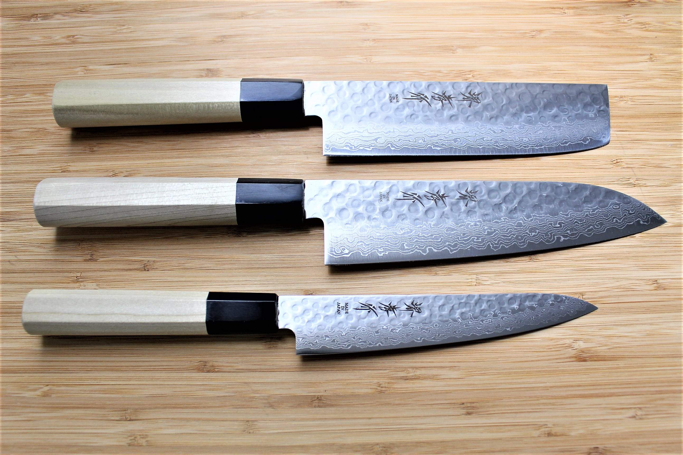 https://hasuseizo.com/cdn/shop/files/kitchen-knives-sakai-takayuki-japanese-knife-set-damascus-45-layer-petty-knife-150mm-5-9-santoku-knife-180mm-7-1-nakiri-knife-160mm-6-3-2_90795d37-6068-4729-9314-7895edd46ff7_5000x.jpg?v=1698702853