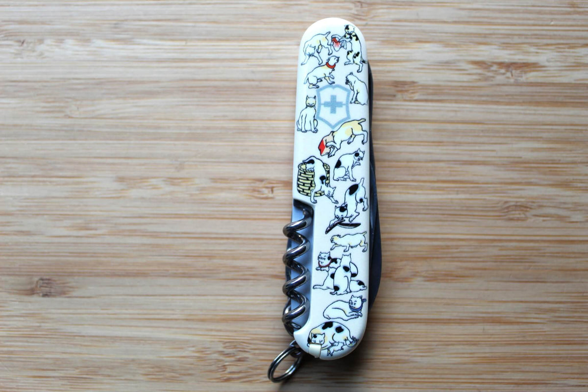 Victorinox Climber 91mm Swiss Army Knife closed, showing Japanese Ukiyo-e Neko-Zukushi artwork with traditional cat illustrations on Cellidor scales