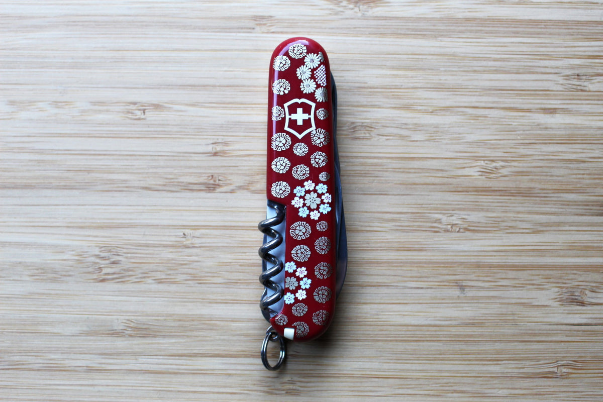 Victorinox Climber 91mm Swiss Army Knife closed, showing Japanese Ukiyo-e Mikaeri Bijin-zu artwork depicting a classical woman looking over her shoulder - back red with flowers.