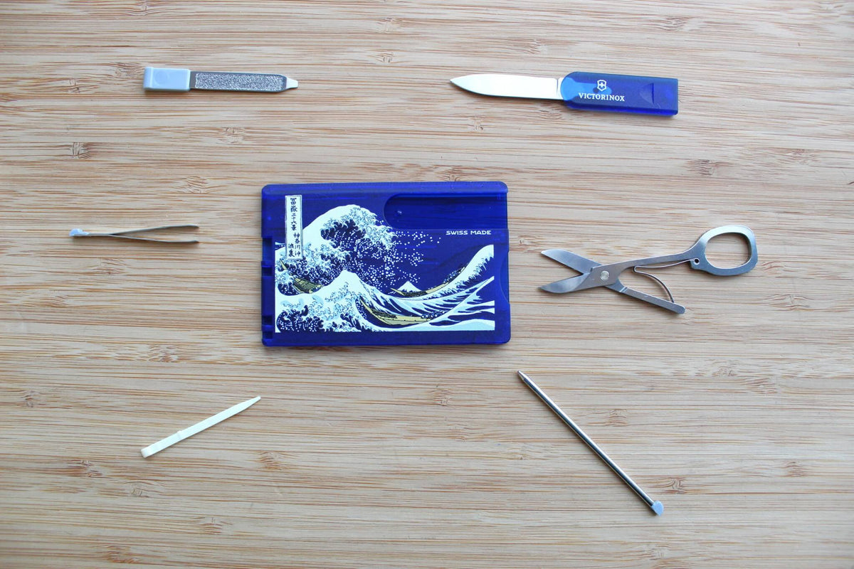 Victorinox Swiss Card Classic showing Katsushika Hokusai's The Great Wave off Kanagawa woodblock print with indigo blue tones