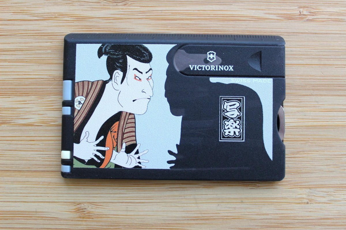Victorinox Swiss Card Classic featuring Tōshūsai Sharaku's classic Kabuki actor portrait on a flat multi-tool profile