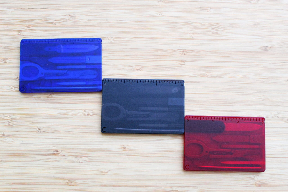 Set of three Victorinox Swiss Card Classic multi-tools featuring Japanese Ukiyo-e artwork: Red Fuji, The Great Wave, and Sharaku displayed together - backs.
